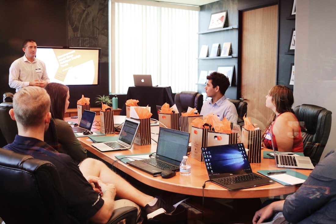 A growing team in a boardroom working session.